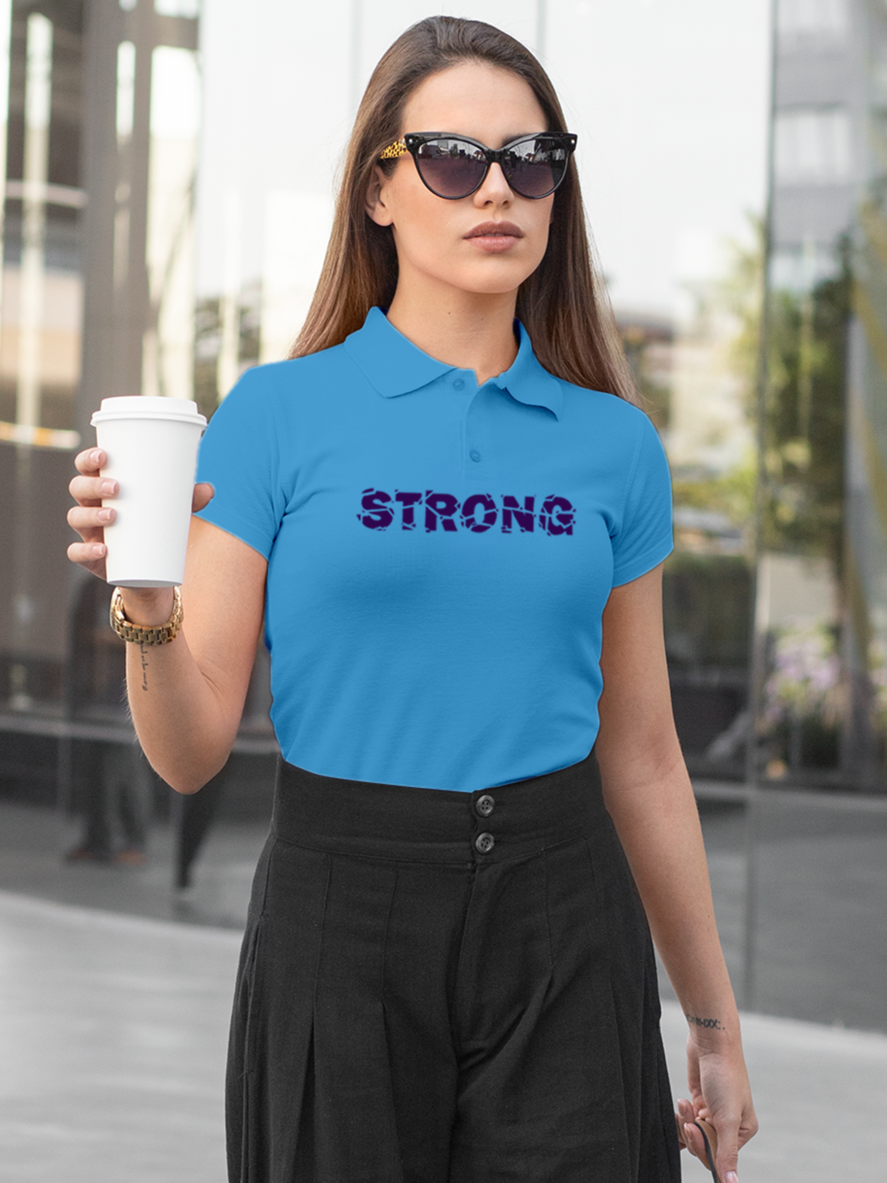 Model wearing Women's Blue Polo T-shirt with 'Strong' design, offering effortless style and premium comfort