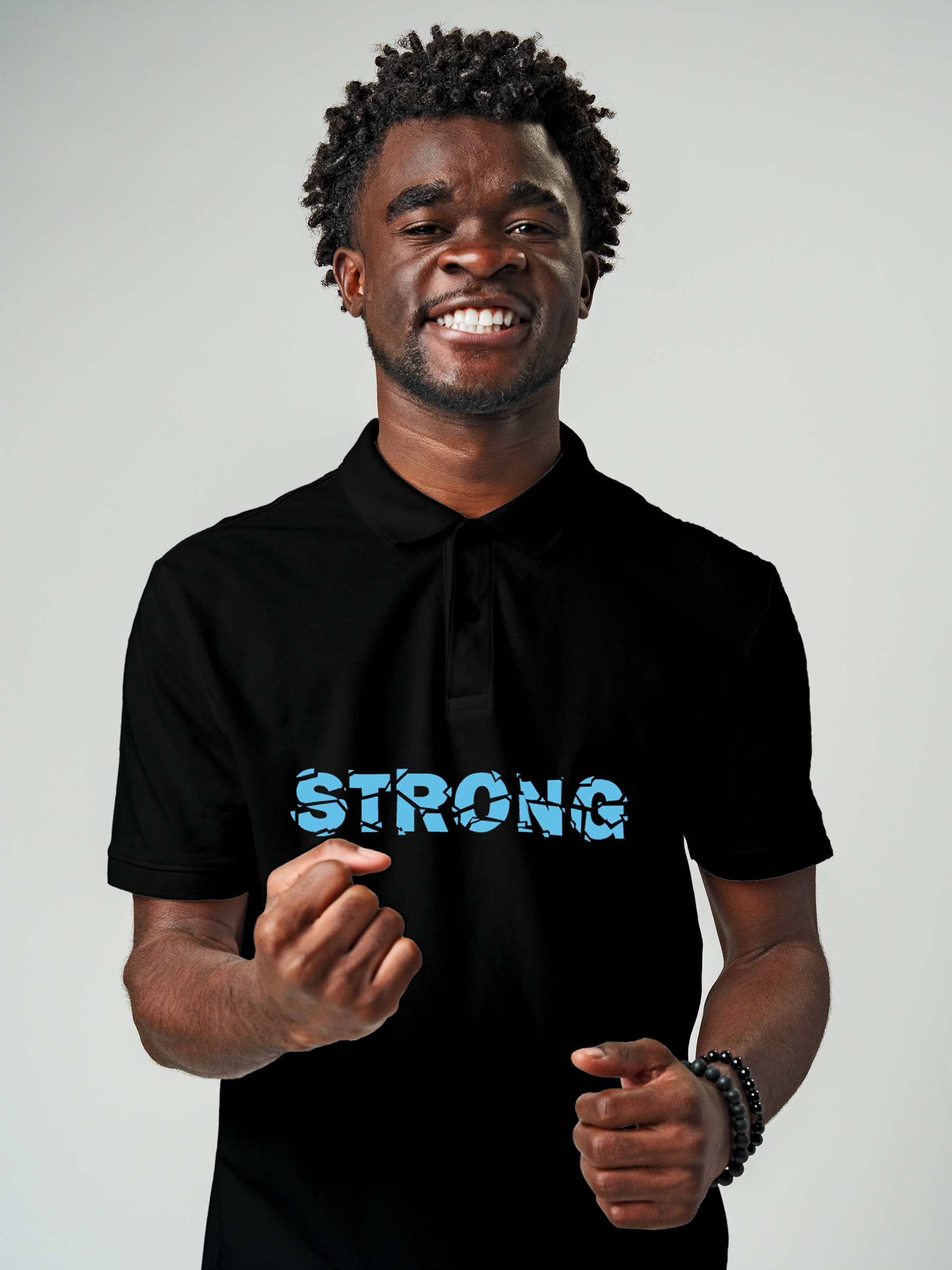 Model wearing Men's Black Polo T-shirt with 'Strong' design, offering effortless style and premium comfort
