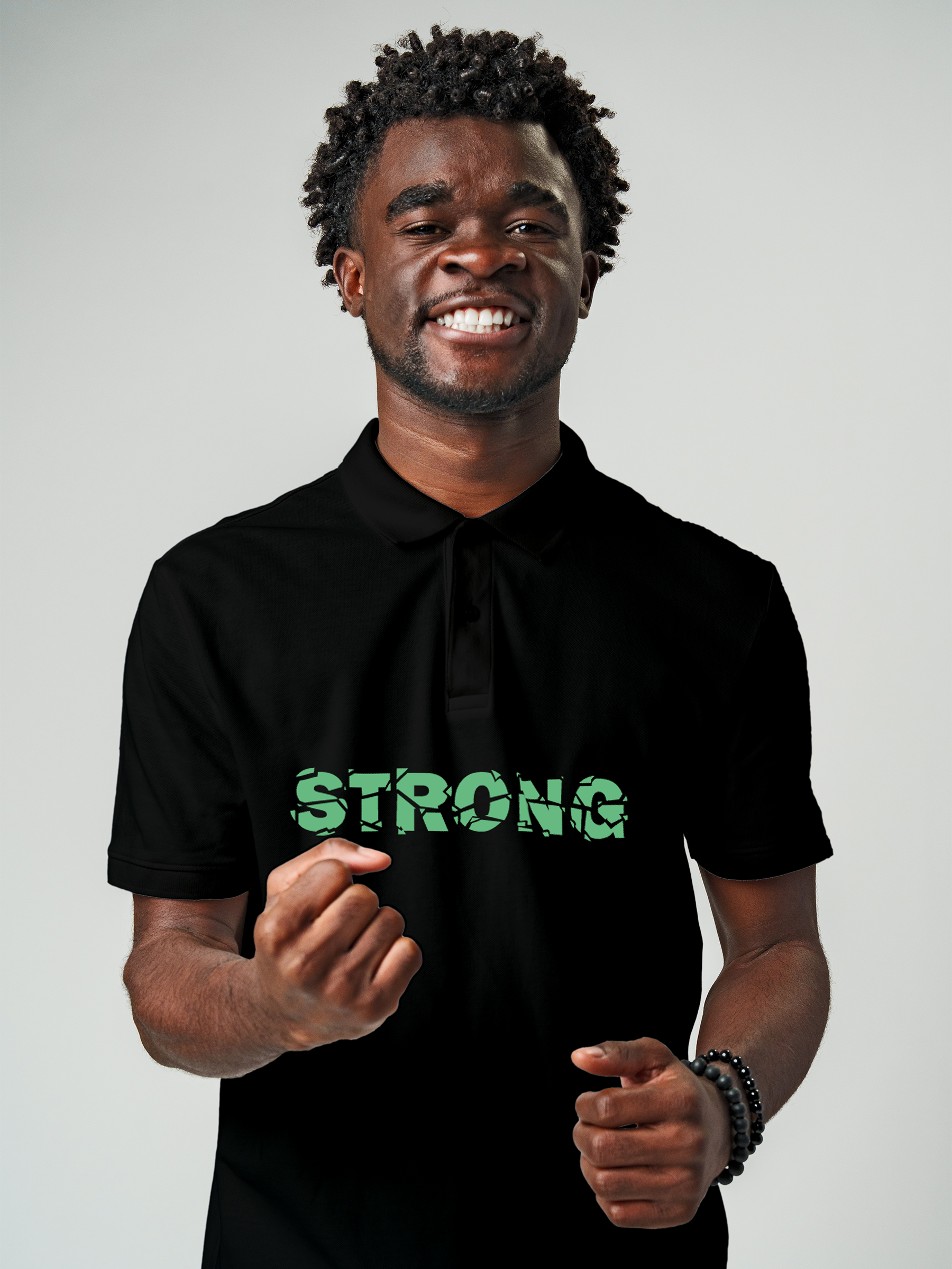 Model wearing Men's Black Polo T-shirt with 'Strong' design, offering effortless style and premium comfort