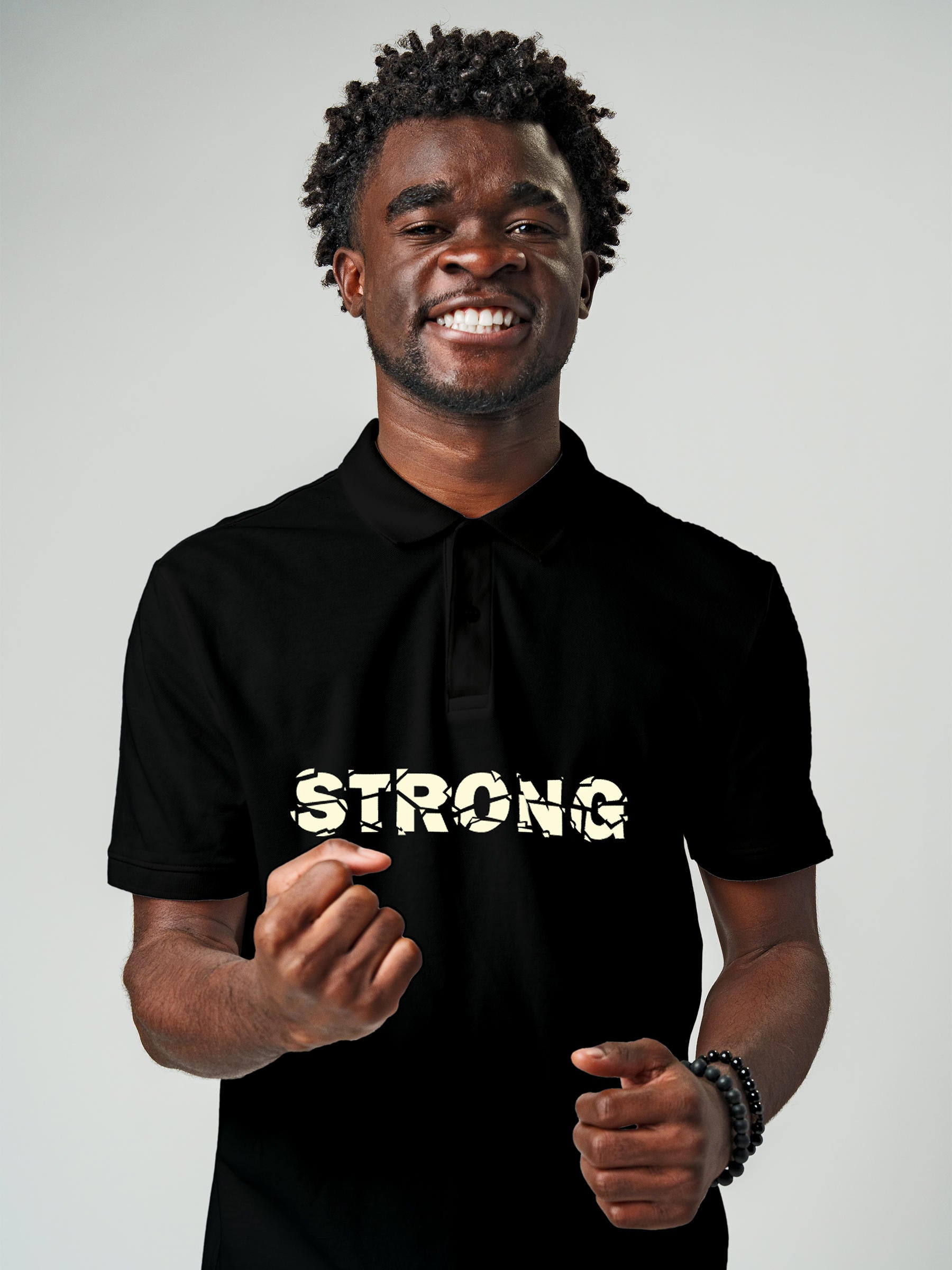 Model wearing Men's Black Polo T-shirt with 'Strong' design, offering effortless style and premium comfort