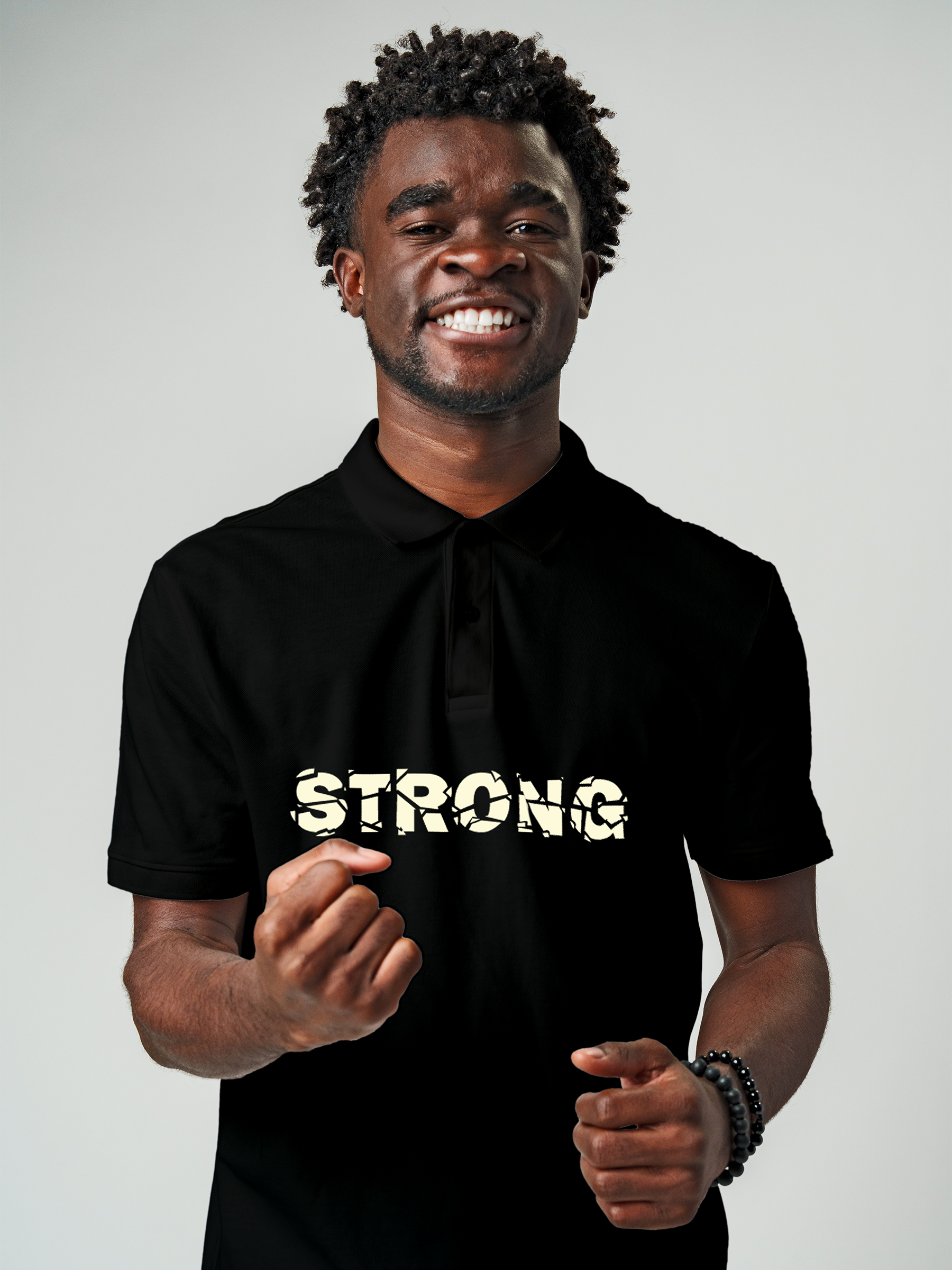 Fighterhero Polo Collection: Model wearing Men's Black Polo T-shirt with 'Strong' design