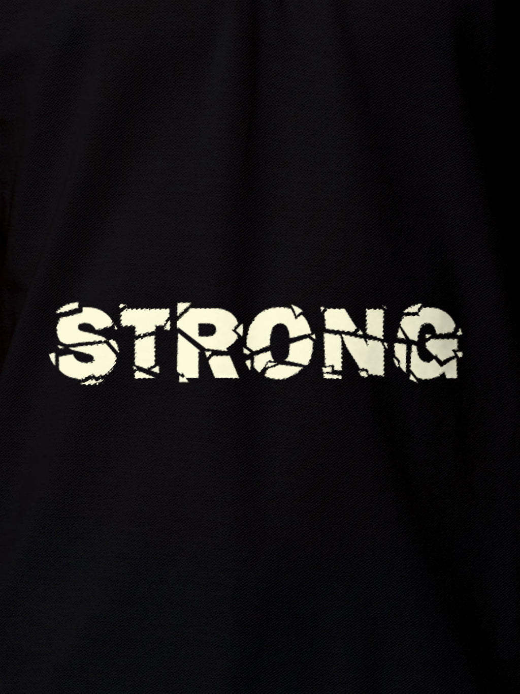 Close up of 'Strong' design on Women's Black Polo T-shirt, highlighting intricate details and vibrant print.