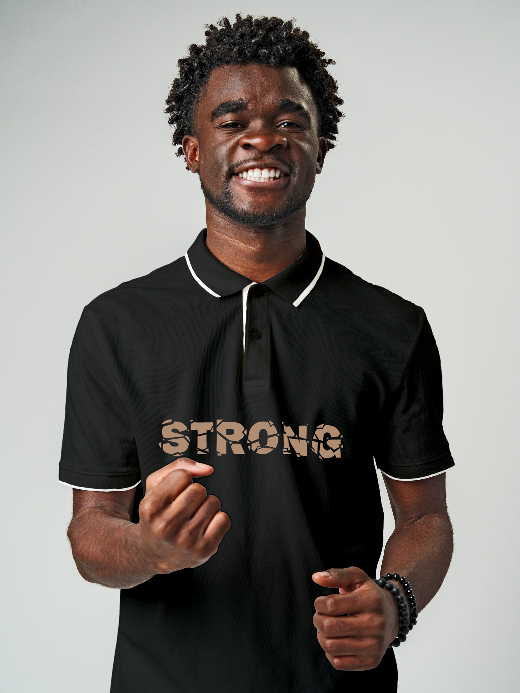 Model wearing Men's Charcoal Grey Polo T-shirt with 'Strong' design, offering effortless style and premium comfort