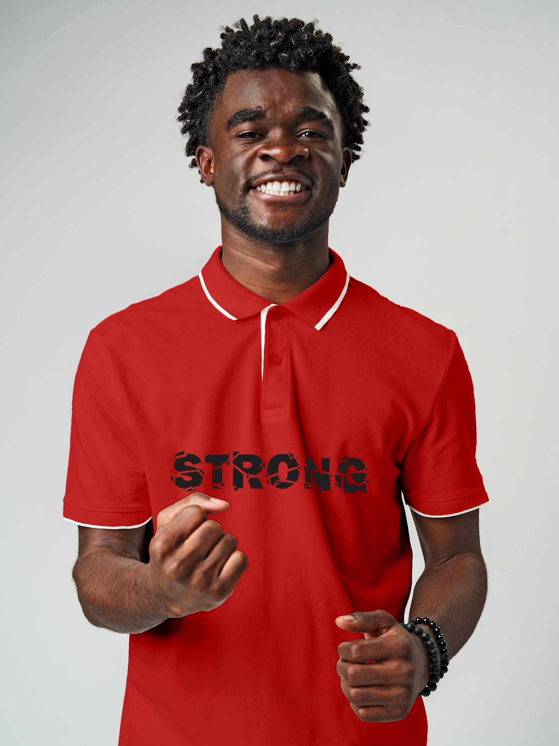 Model wearing Men's Red Polo T-shirt with 'Strong' design, offering effortless style and premium comfort