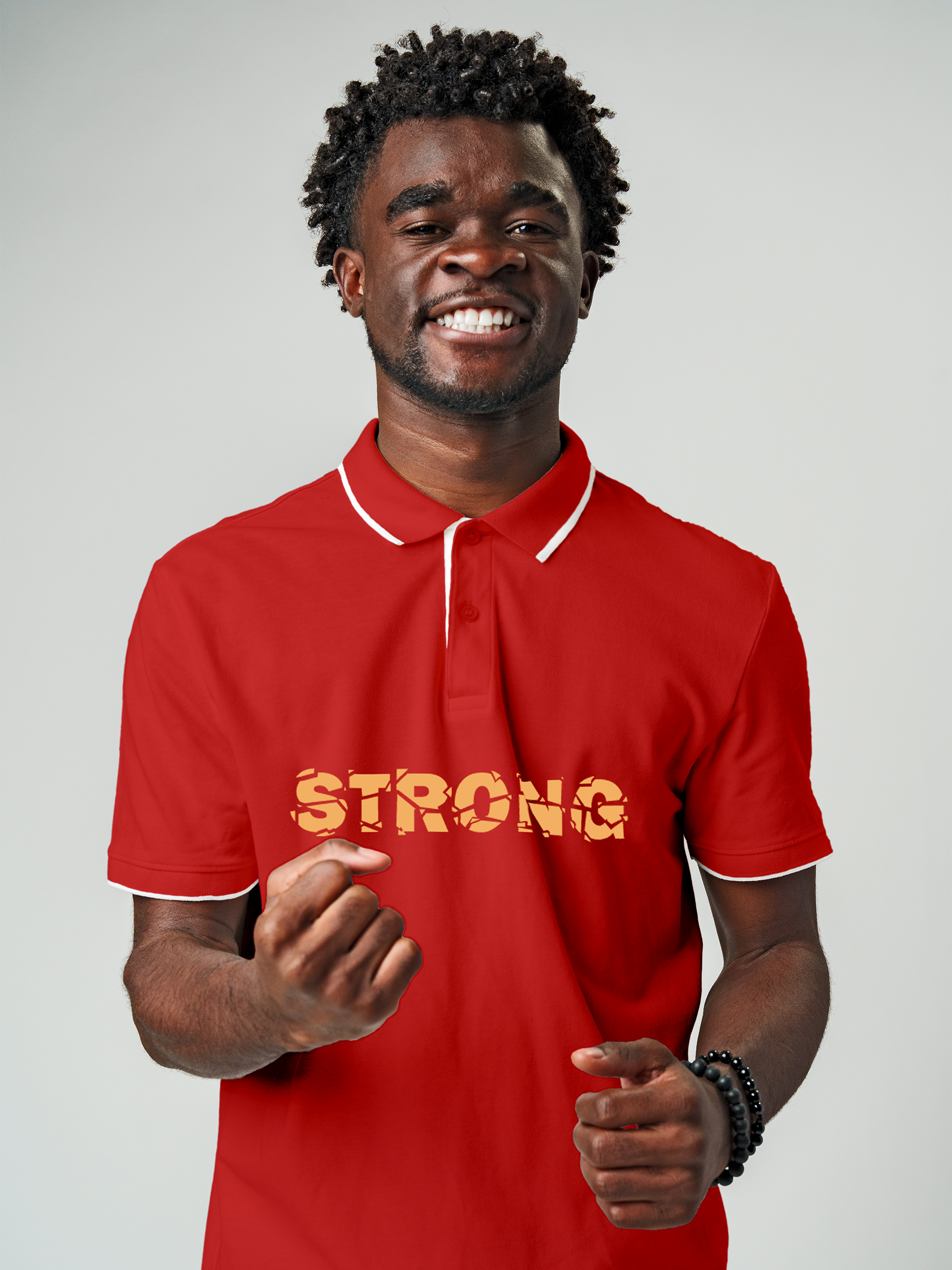 Model wearing Men's Red Polo T-shirt with 'Strong' design, offering effortless style and premium comfort