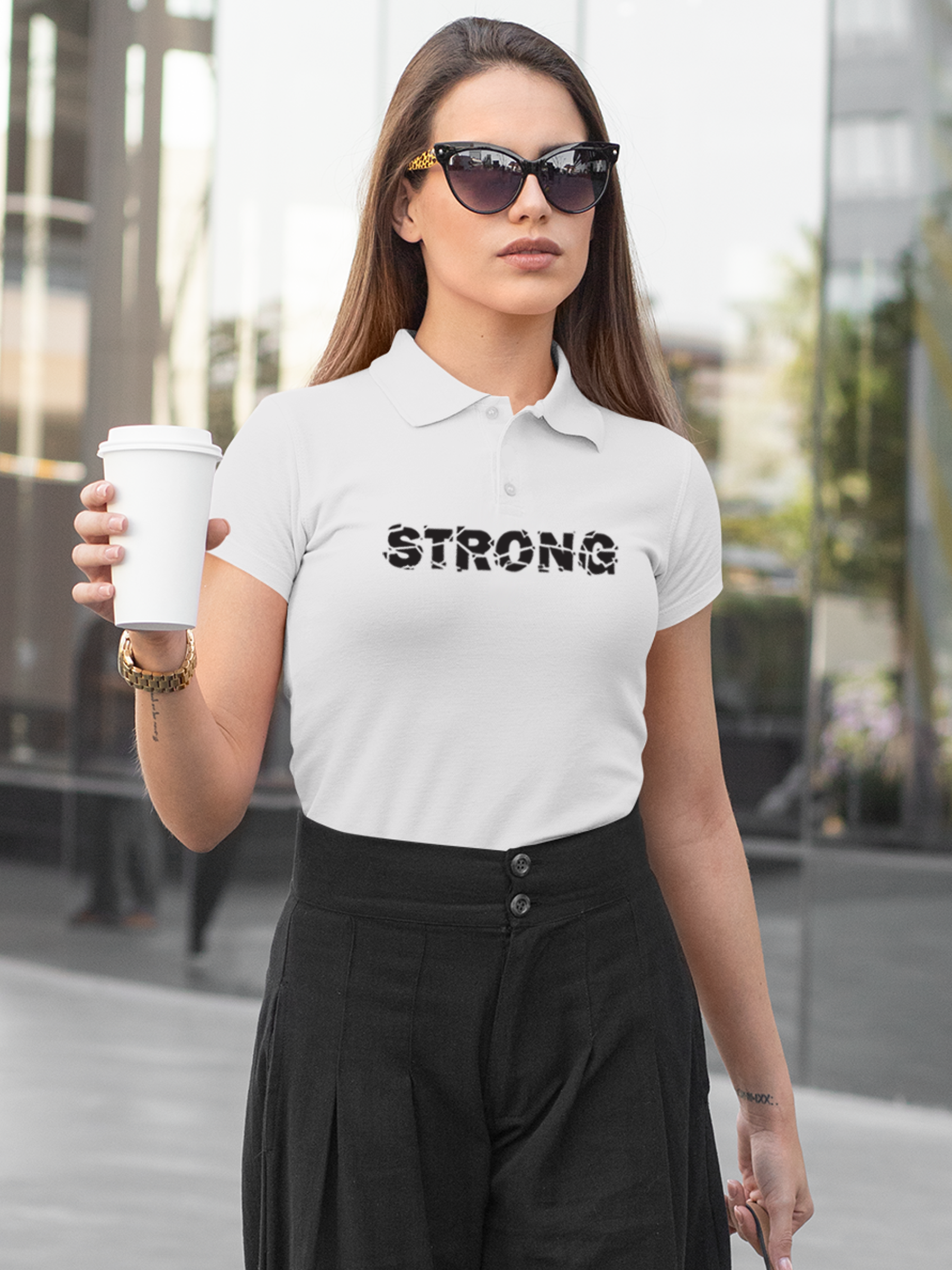 Model wearing Women's White Polo T-shirt with 'Strong' design, offering effortless style and premium comfort