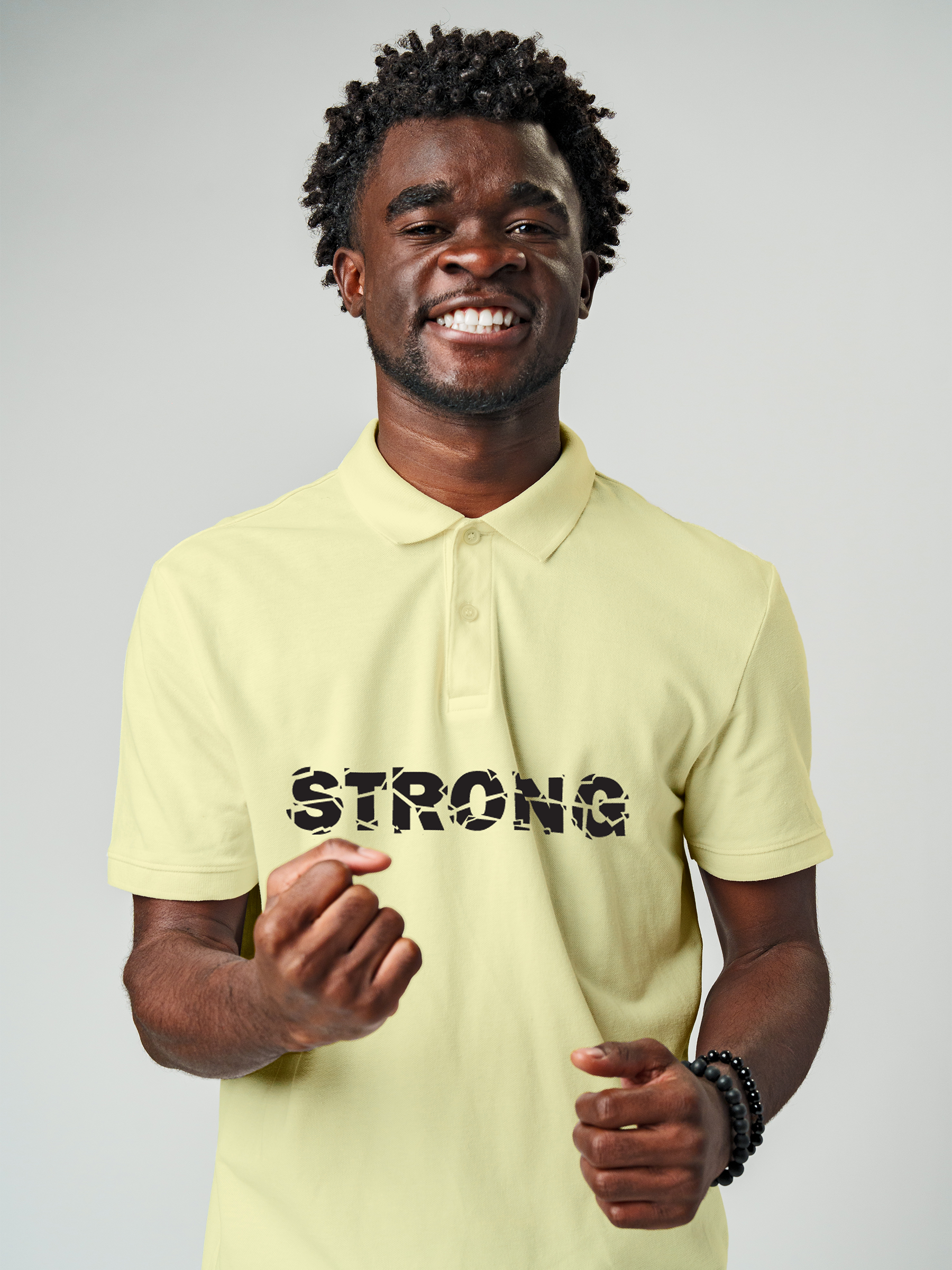 Model wearing Men's Yellow Polo T-shirt with 'Strong' design, offering effortless style and premium comfort
