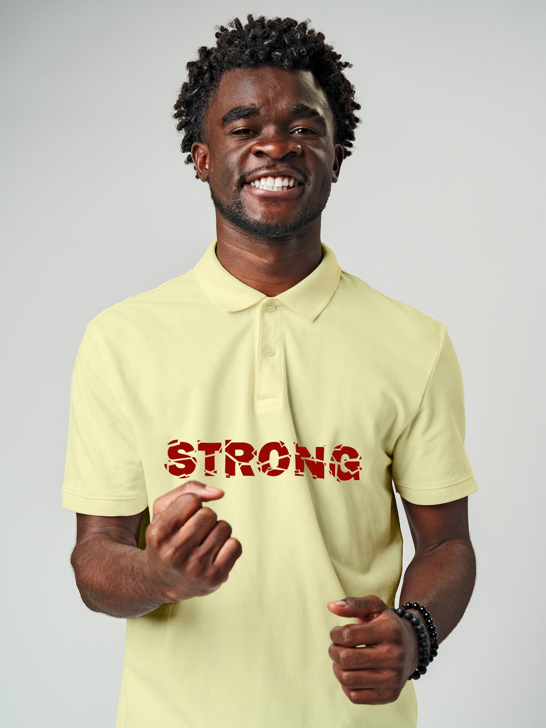 Model wearing Men's Yellow Polo T-shirt with 'Strong' design, offering effortless style and premium comfort