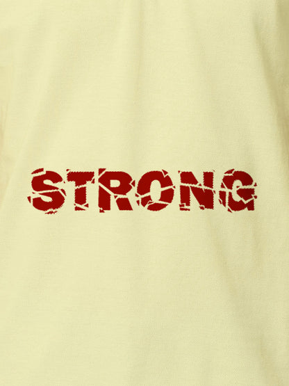 Close up of 'Strong' design on Women's Yellow Polo T-shirt, highlighting intricate details and vibrant print.