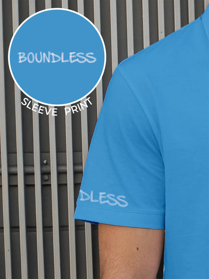 Close up of 'Boundless' print on the sleeve of Men's Blue Collar T-shirt, highlighting the vibrant print.