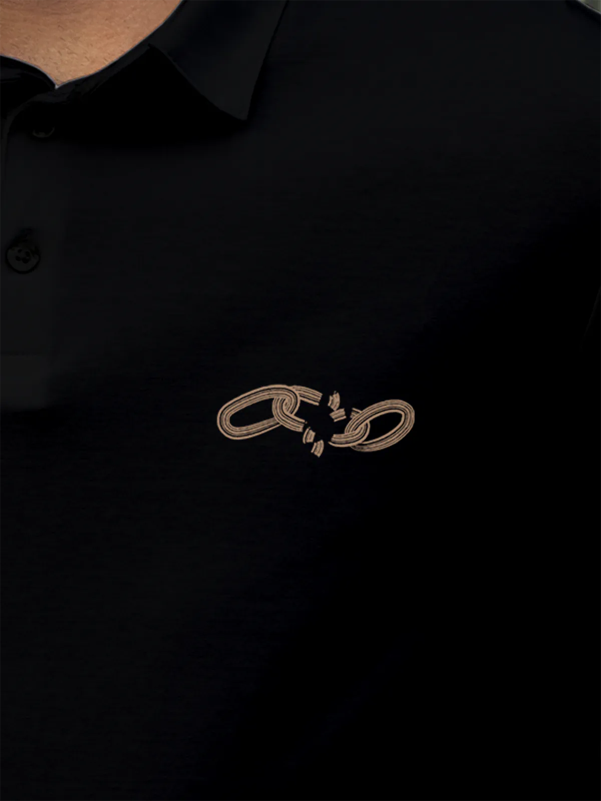 Close up of 'Boundless' design on Men's Black Collar T-shirt, highlighting intricate details and vibrant print.