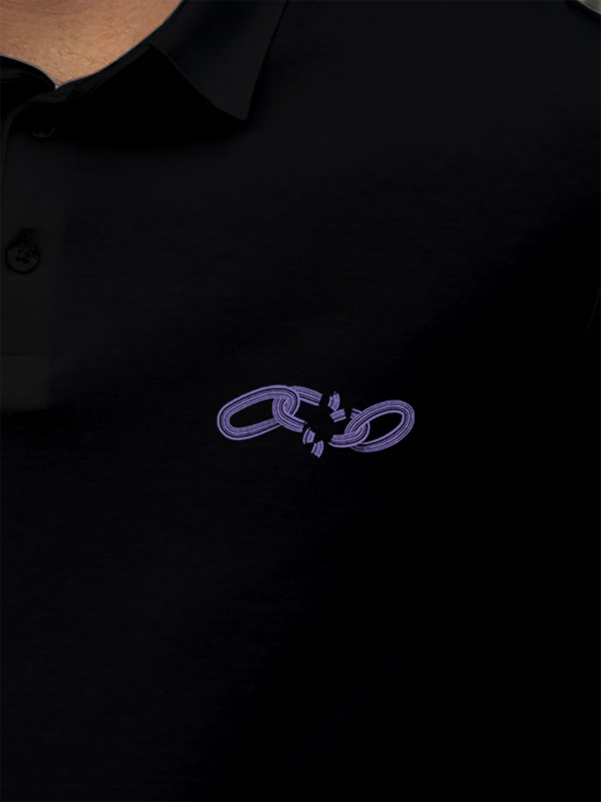Close up of 'Boundless' design on Men's Black Collar T-shirt, highlighting intricate details and vibrant print.