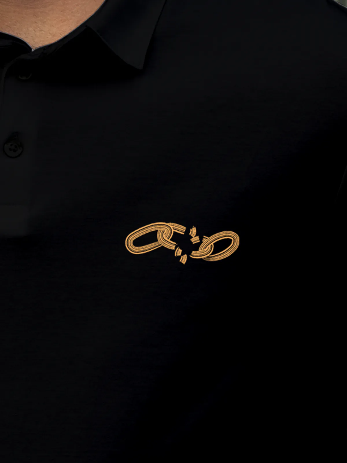 Close up of 'Boundless' design on Men's Black Collar T-shirt, highlighting intricate details and vibrant print.