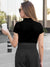 Back view of Fighterhero Women's Black Polo T-shirt with 'Boundless' design, highlighting the modern look and clean finish