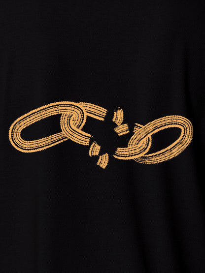 Close up of 'Boundless' design on Women's Black Polo T-shirt, highlighting intricate details and vibrant print.