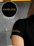 Close up of 'Boundless' print on the sleeve of Women's Black Collar T-shirt, highlighting the vibrant print.