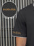 Close up of 'Boundless' print on the sleeve of Men's Dark Grey Collar T-shirt, highlighting the vibrant print.