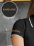 Close up of 'Boundless' print on the sleeve of Women's Dark Grey Collar T-shirt, highlighting the vibrant print.