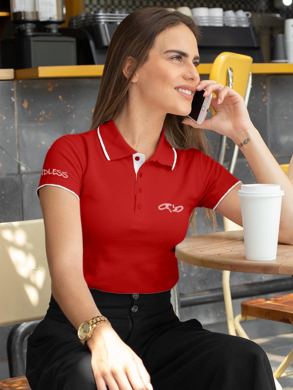 Model wearing Women's Red Polo T-shirt with 'Boundless' design, offering effortless style and premium comfort