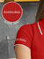 Close up of 'Boundless' print on the sleeve of Women's Red Collar T-shirt, highlighting the vibrant print.