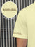 Close up of 'Boundless' print on the sleeve of Men's Yellow Collar T-shirt, highlighting the vibrant print.