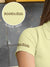 Close up of 'Boundless' print on the sleeve of Women's Yellow Collar T-shirt, highlighting the vibrant print.