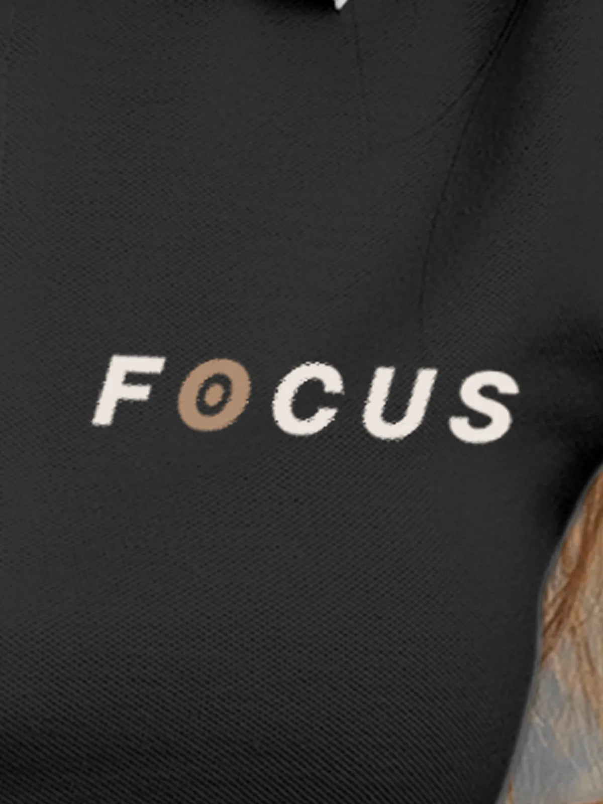 Close up of 'Focus' design on Women's Dark Grey Collar T-shirt, highlighting intricate details and vibrant print.