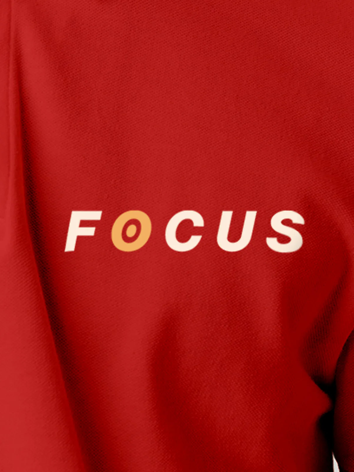Close up of 'Focus' design on Men's Red Collar T-shirt, highlighting intricate details and vibrant print.