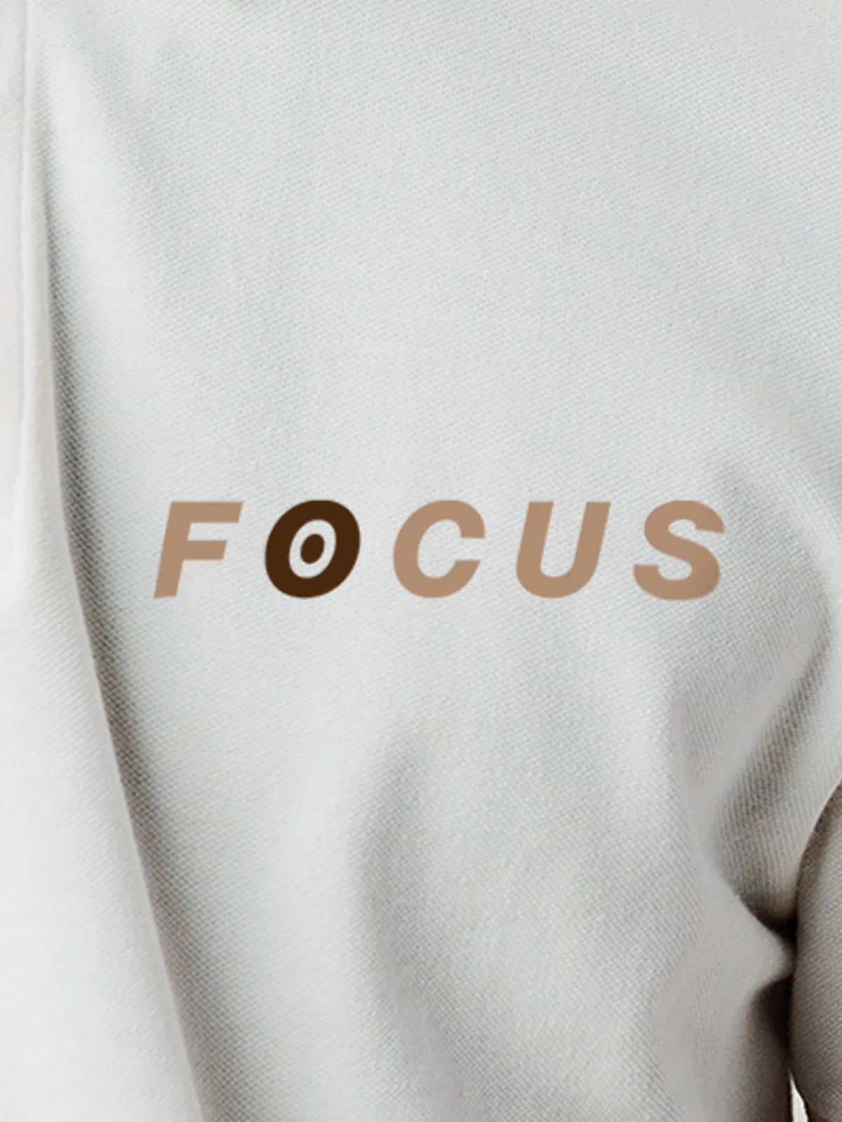 Close up of 'Focus' design on Men's White Collar T-shirt, highlighting intricate details and vibrant print.
