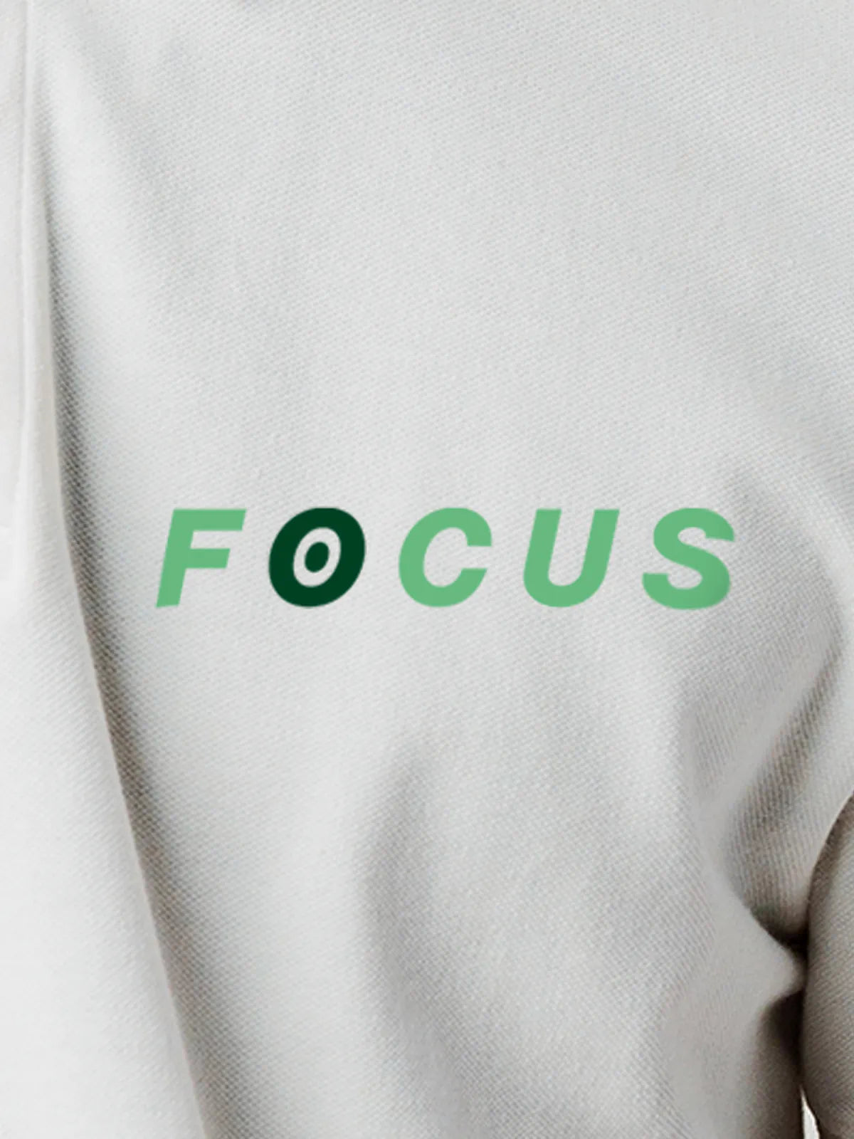 Close up of 'Focus' design on Men's White Collar T-shirt, highlighting intricate details and vibrant print.