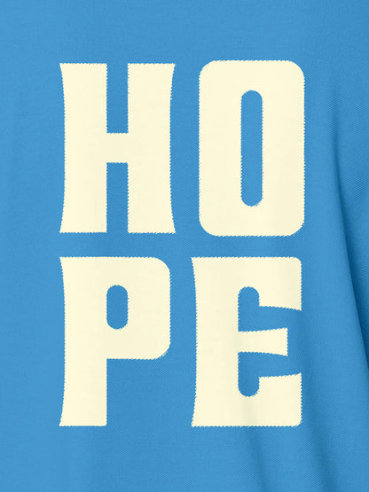 Close up of 'Hope' design on Men's Blue Polo T-shirt, highlighting intricate details and vibrant print.