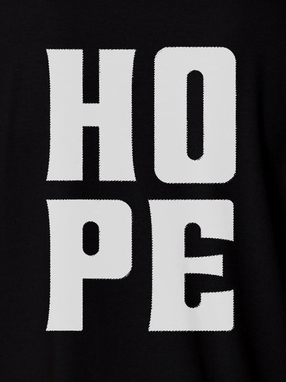 Close up of 'Hope' design on Men's Black Polo T-shirt, highlighting intricate details and vibrant print.