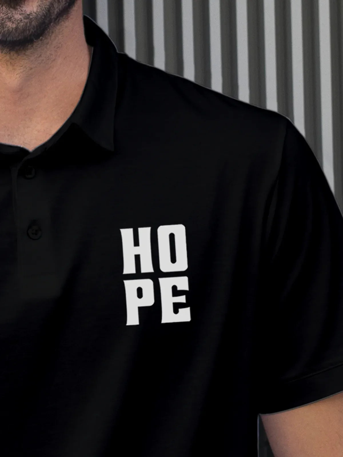 Close up of 'Hope' on Men's Black Polo T-shirt, highlighting intricate details and vibrant print.