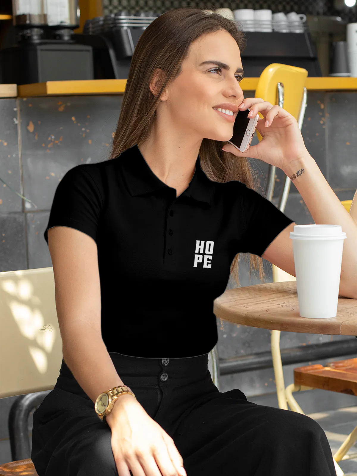 Model wearing Women's Black Polo T-shirt with 'Hope' design, offering effortless style and premium comfort