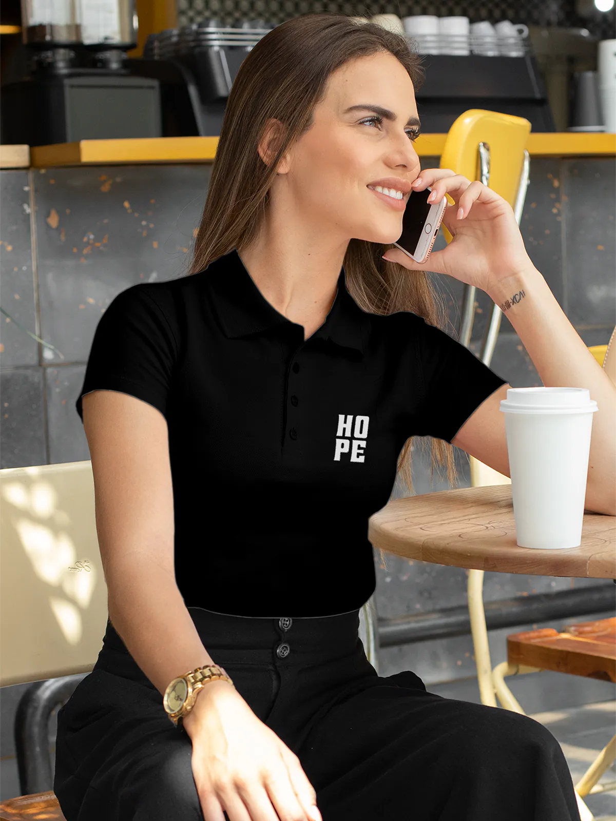 Model wearing Women's Black Polo T-shirt with Hope, offering effortless style and premium comfort