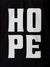 Close up of 'Hope' design on Women's Black Polo T-shirt, highlighting intricate details and vibrant print.
