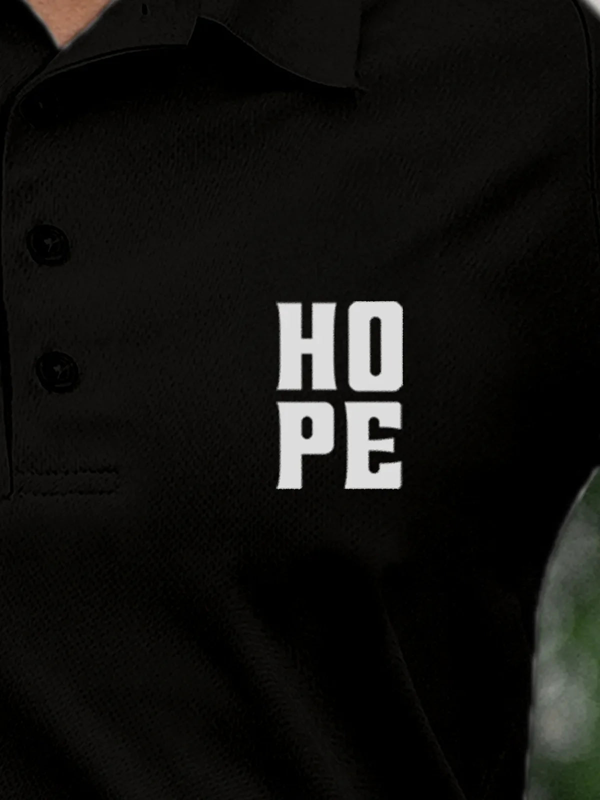 Close up of 'Hope' on Women's Black Polo T-shirt, highlighting intricate details and vibrant print.