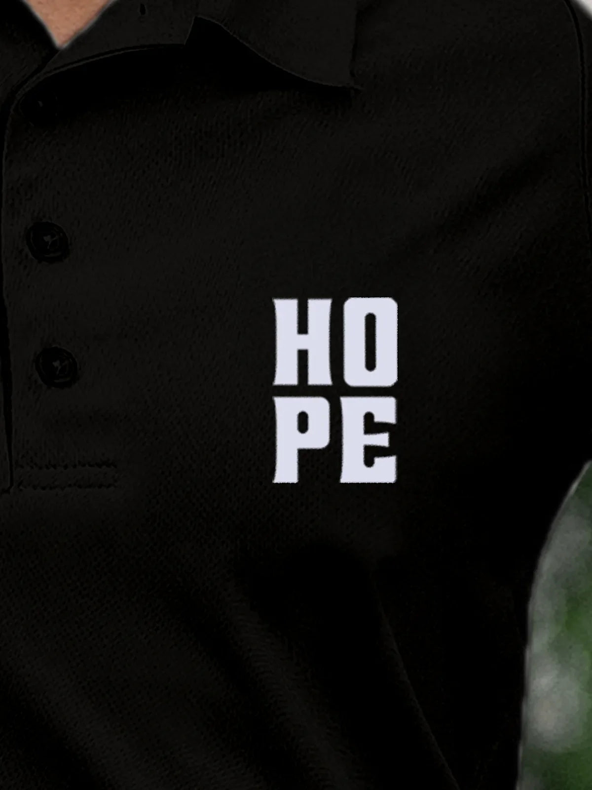 Close up of 'Hope' on Women's Black Polo T-shirt, highlighting intricate details and vibrant print.