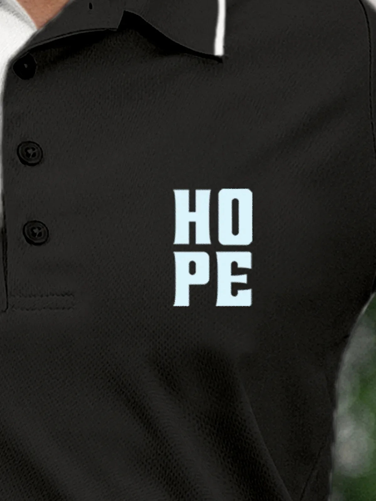 Close up of 'Hope' on Women's Dark Grey Polo T-shirt, highlighting intricate details and vibrant print.