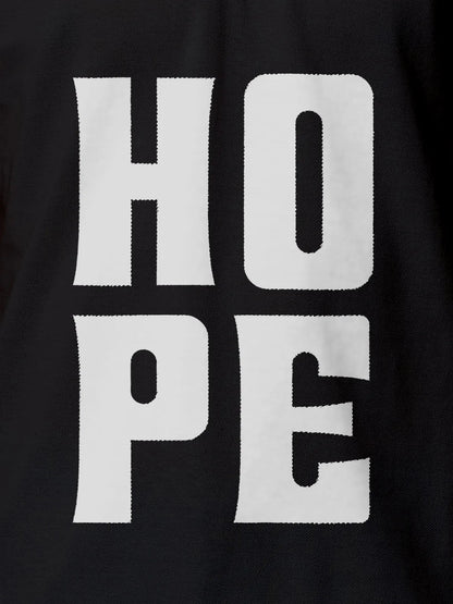Close up of 'Hope' design on Women's Dark Grey Polo T-shirt, highlighting intricate details and vibrant print.