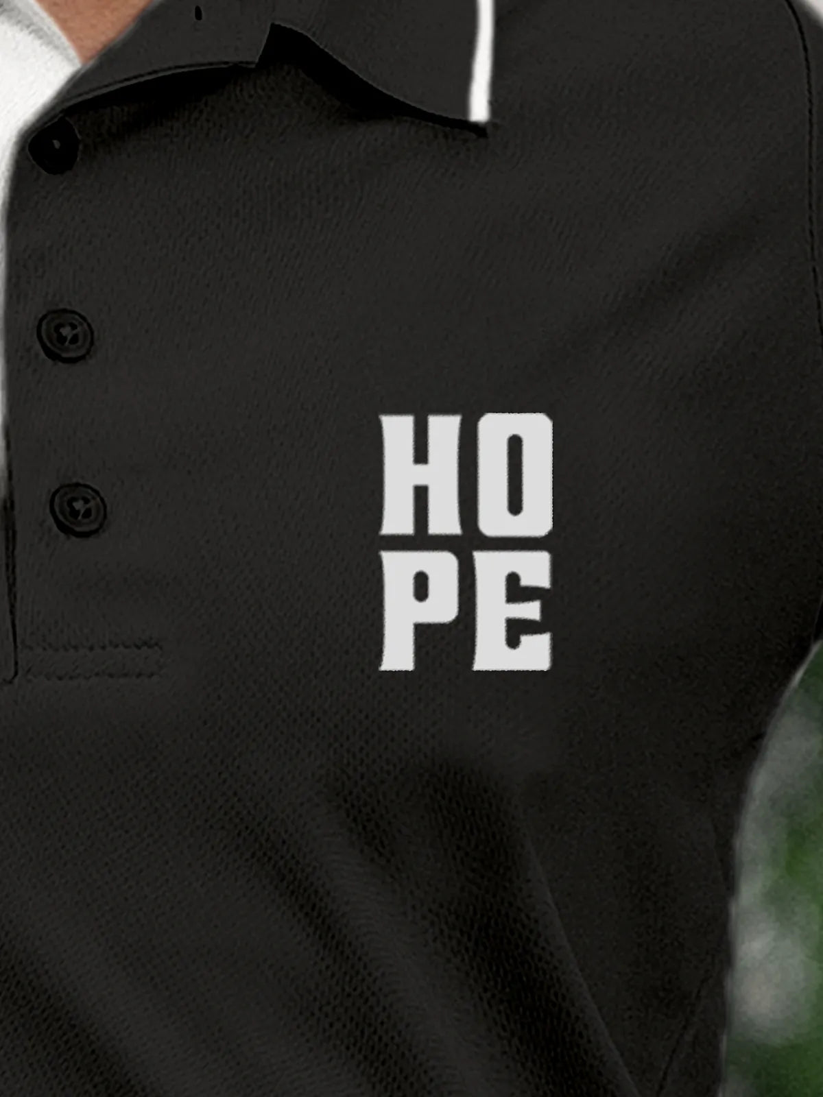 Close up of 'Hope' on Women's Dark Grey Polo T-shirt, highlighting intricate details and vibrant print.