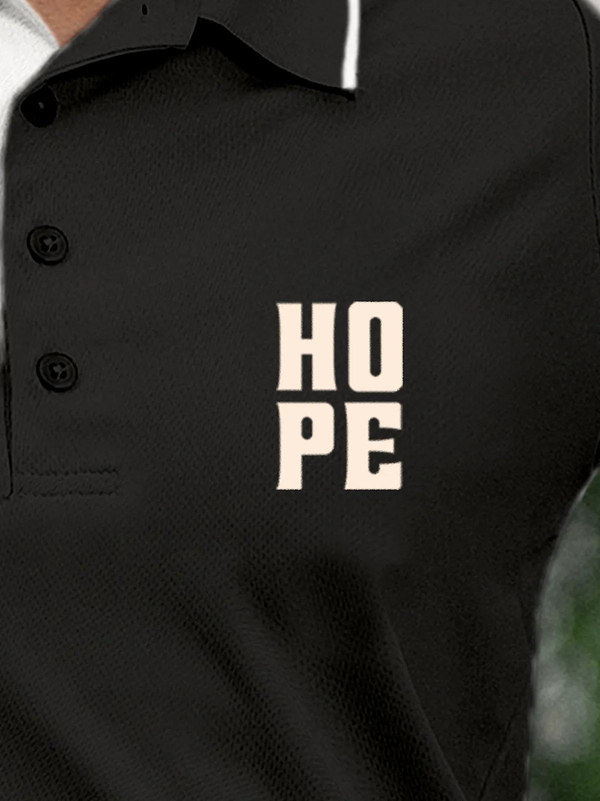 Close up of 'Hope' on Women's Dark Grey Polo T-shirt, highlighting intricate details and vibrant print.