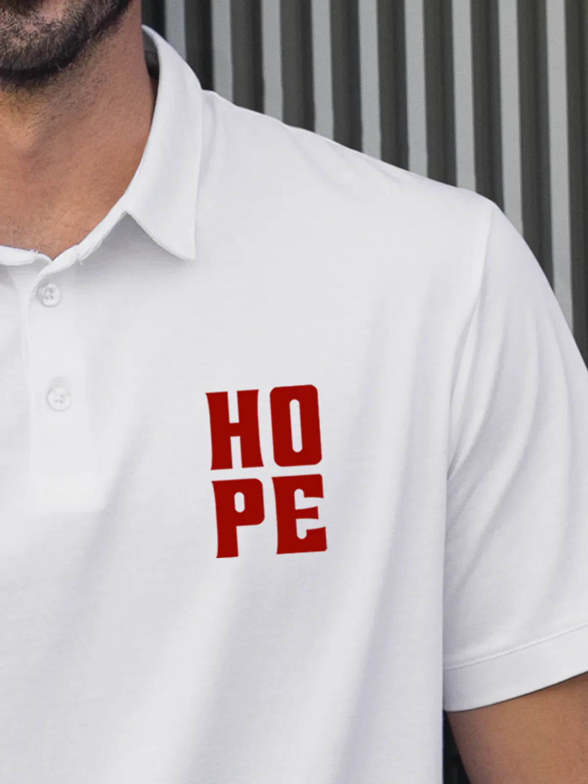 Close up of 'Hope' on Men's White Polo T-shirt, highlighting intricate details and vibrant print.