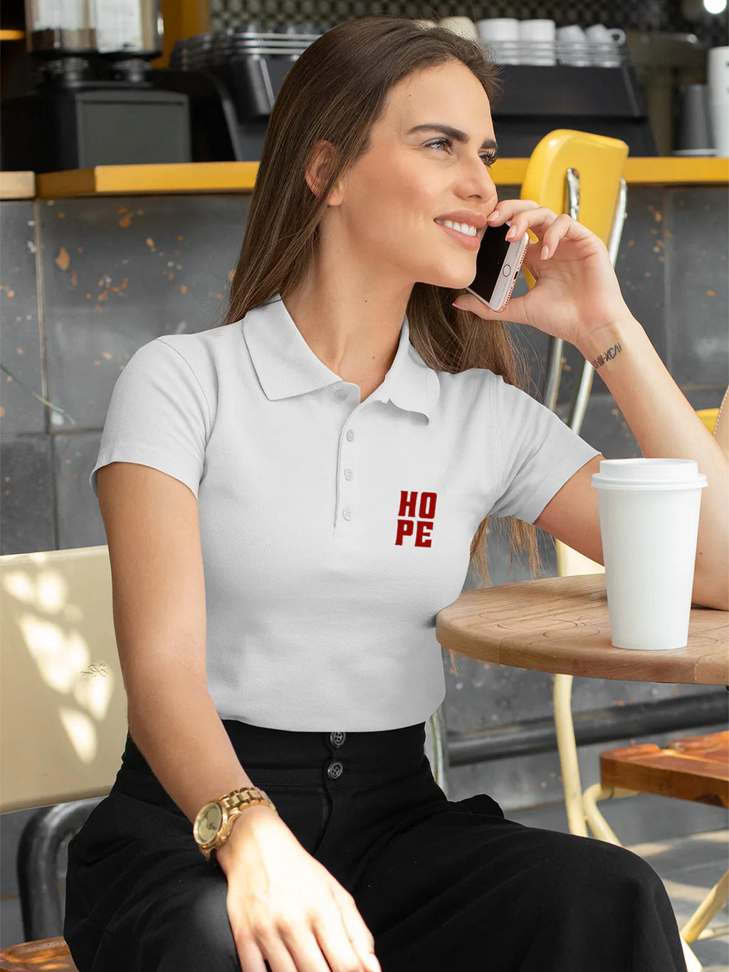 Model wearing Women's White Polo T-shirt with 'Hope' design, offering effortless style and premium comfort