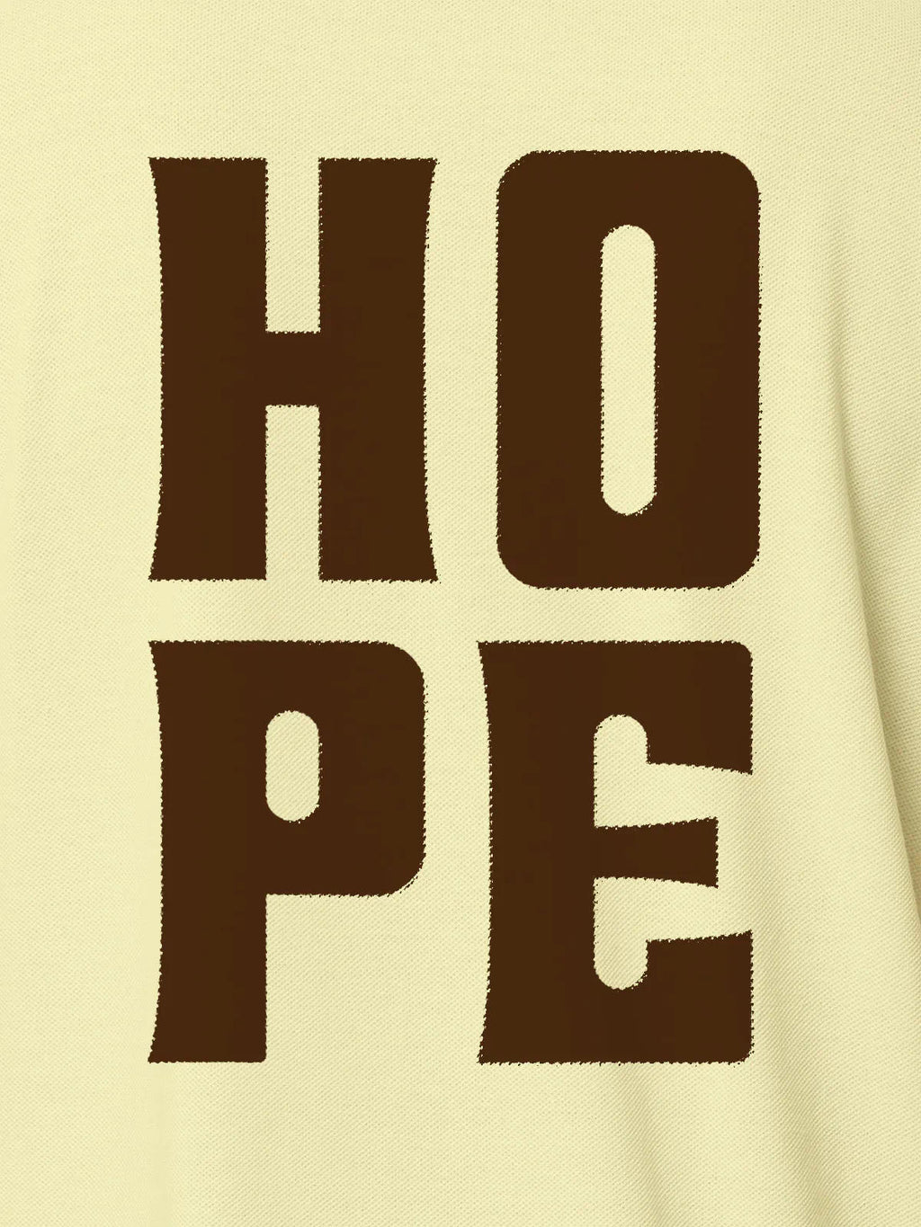 Close up of 'Hope' design on Men's Yellow Polo T-shirt, highlighting intricate details and vibrant print.