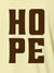 Close up of 'Hope' design on Men's Yellow Polo T-shirt, highlighting intricate details and vibrant print.