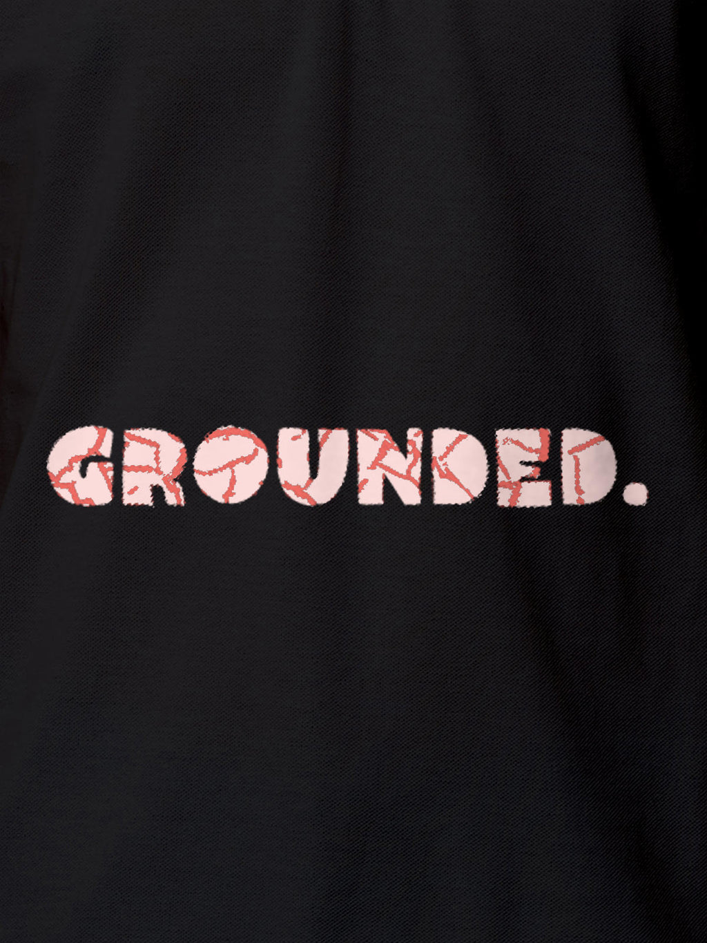 Close up of 'Grounded' design on Men's Dark Grey Polo T-shirt, highlighting intricate details and vibrant print.