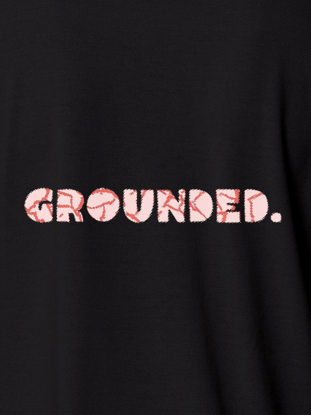 Close up of 'Grounded' design on Women's Dark Grey Polo T-shirt, highlighting intricate details and vibrant print.