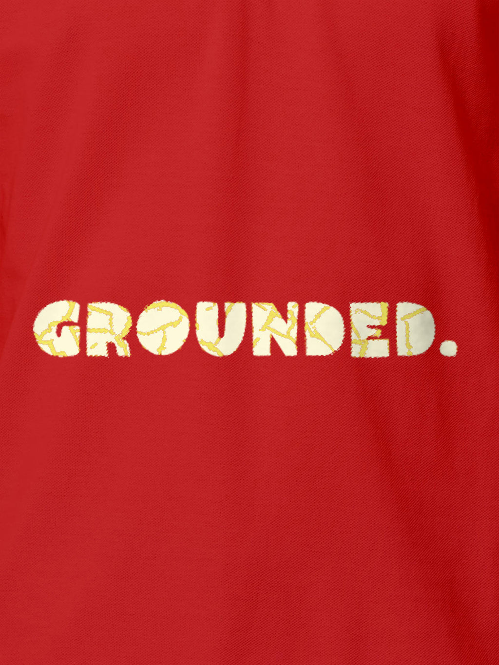 Close up of 'Grounded' design on Men's Red Polo T-shirt, highlighting intricate details and vibrant print.