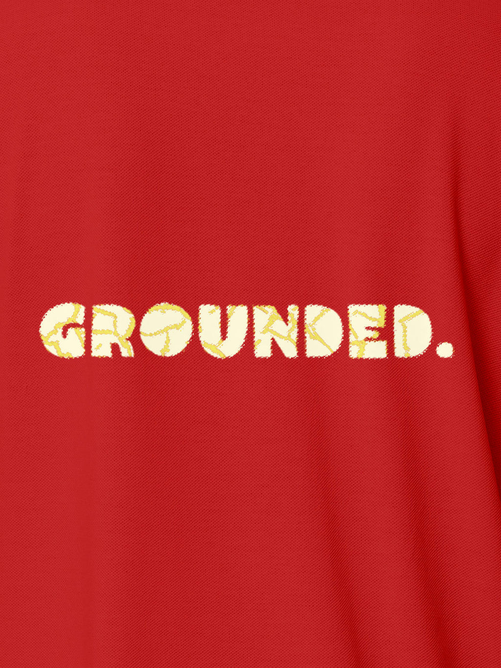 Close up of 'Grounded' design on Women's Red Polo T-shirt, highlighting intricate details and vibrant print.